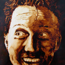 Andrew Saur created this original "Andy Self Portrait" Coffee Art® painting. It features the artist being excited about being created with coffee.