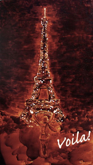 Angel Sarkela-Saur created this original "Voilà!" Coffee Art® painting. It features a person gazing up in amazement at the Eiffel Tower.