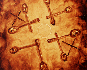Andrew Saur &amp; Angel Sarkela-Saur created this original "XOX" Coffee Art&reg; painting. It features a game of tic-tac-toe using a coffee ring and stir sticks.