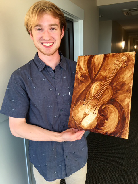 The happy violinist-dentist and his custom Coffee Art painting.